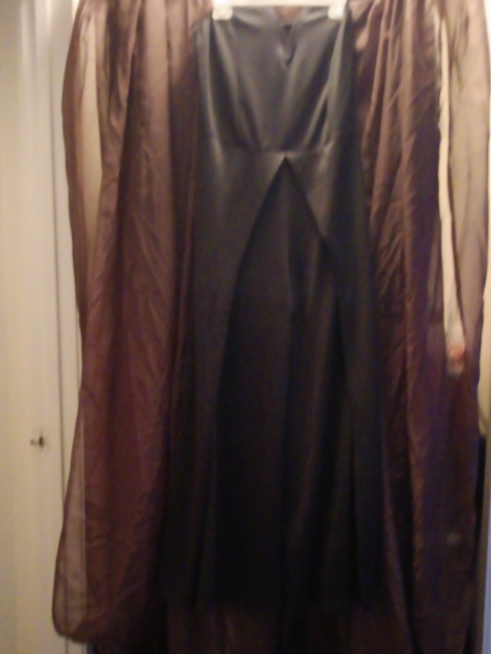 Elegant Black Women’s Jumpsuit with overlay  and high leg slits.